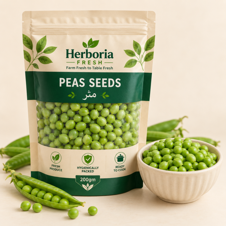 Fresh peeled green peas matar in ceramic bowl with pea pods on cream background