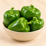 Herboria Fresh Green Capsicum Whole 500g pouch with whole green capsicum in ceramic bowl