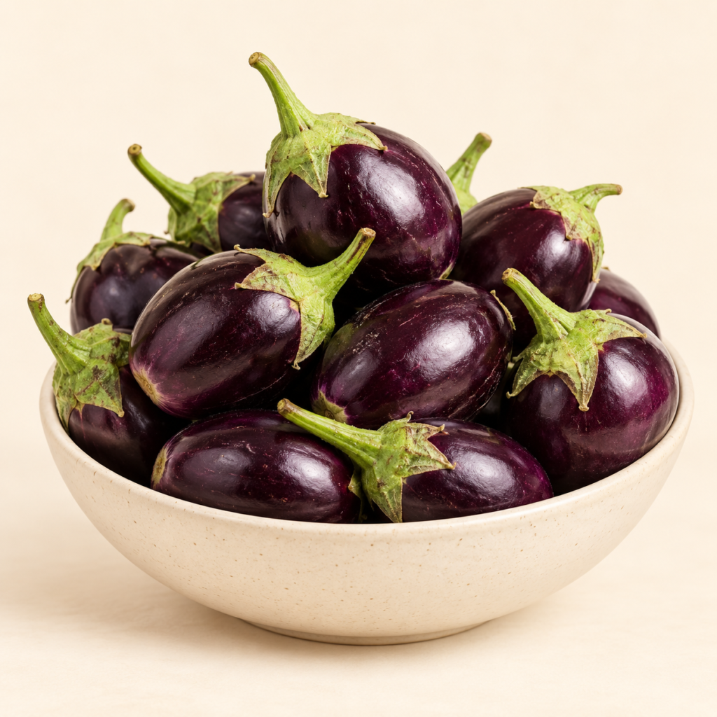 Herboria Fresh Brinjal Whole 500g pouch with fresh purple brinjals in bowl