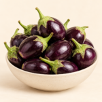 Herboria Fresh Brinjal Whole 500g pouch with fresh purple brinjals in bowl