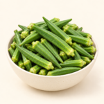 Fresh whole lady finger bhindi okra in ceramic bowl on cream background