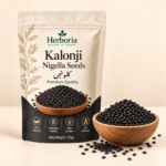 Herboria Kalonji Nigella Seeds 100g pouch with premium black seeds in wooden bowl
