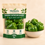 Fresh whole green capsicum shimla mirch in ceramic bowl on cream background