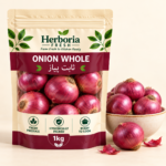 Fresh whole red onions pyaz in ceramic bowl on cream background