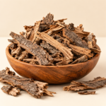 Natural Acacia Tree Bark Chaal Kikar Babool bark pieces in wooden bowl on cream background
